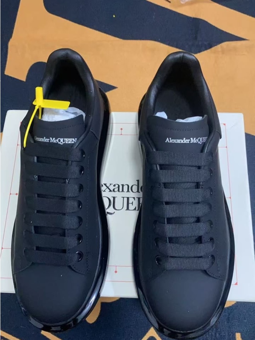 Alexander McQueen Black Leather Low-Top Sneakers with Yellow Zip Tag